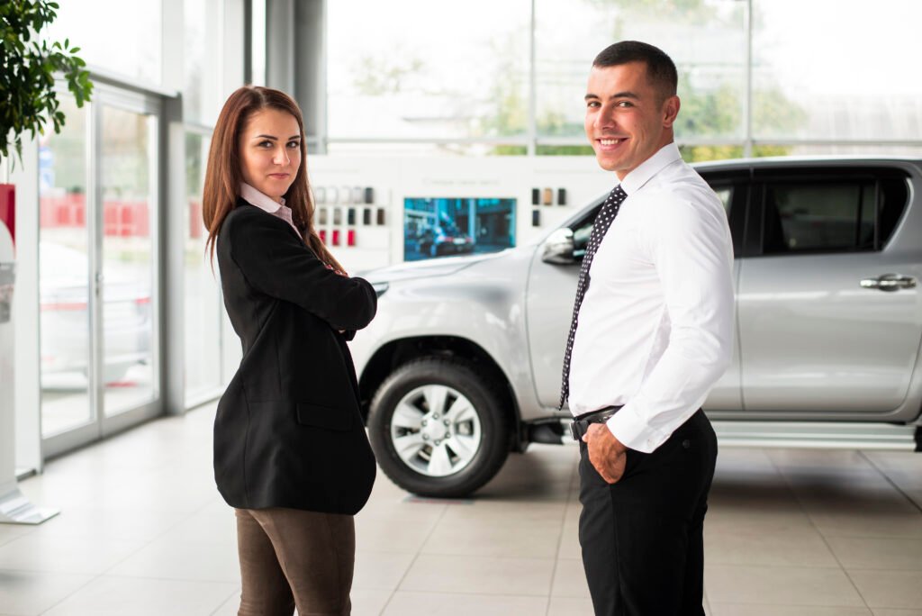 young-man-woman-dealership